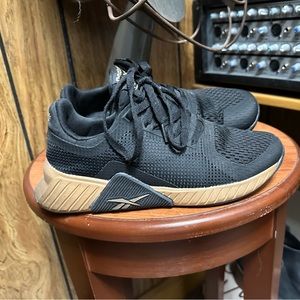 Black & Gold Reebok shoes